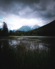 Beautiful alpine scene. Little lake in Ramsau, Berchtesgaden. Hochkalter mountain range in background 