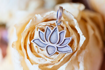 Detail of sterling silver pendant in the shape of lotus