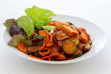 Stir fried with pork and vegetables sprinkle sesame seeds