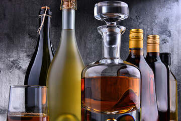 Carafe and bottles of assorted alcoholic beverages.