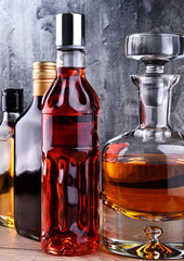 Carafe and bottles of assorted alcoholic beverages.