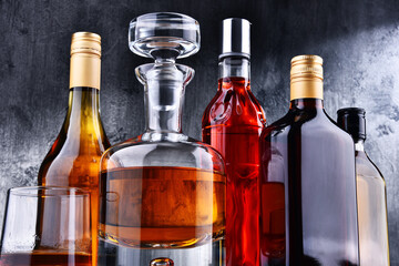 Carafe and bottles of assorted alcoholic beverages.