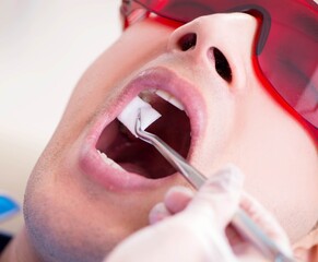 Patient visiting dentist for regular check-up and filling