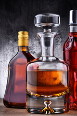 Carafe and bottles of assorted alcoholic beverages.