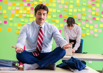 Man and woman in the office with many conflicting priorities in