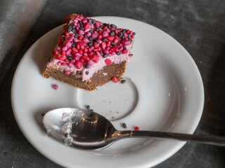 Chocolate and raspberry pastry on a white plate