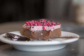 Chocolate and raspberry pastry on a white plate