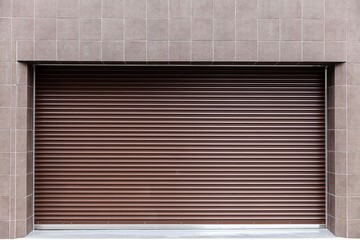 Brown automatic roller shutter doors on the ground floor of the house