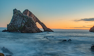 Sunrise at Bow Fiddle Rock in Scotland