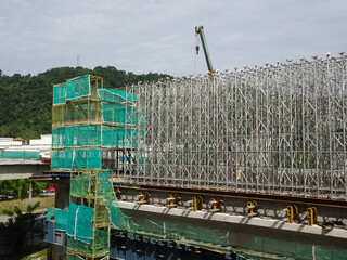 KUALA LUMPUR, MALAYSIA -JULY 29, 2019: Scaffolding is installed on the construction site as...