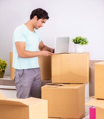 Young man moving to new apartment