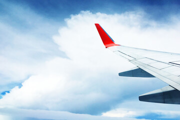 Fototapeta premium beautiful landscape view background of sky above cloud plane's window and see plane's wing