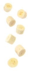 Set with delicious ripe banana pieces falling on white background
