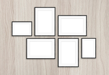 Photo frames set on wooden background, six realistic frameworks, interior decor mock up