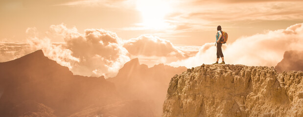 silhouette of successful climbing woman in mountains Concept of concept of motion motivation...