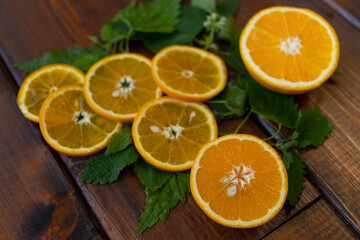 Fototapeta na wymiar orange slices on a brown wooden background, top view, text space, citrus