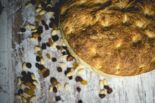 Top View of Freshly Baked Loaf of Bread with nuts.