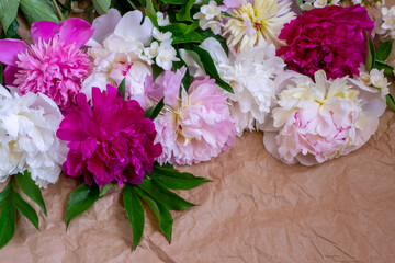 bouquet of flowers from peonies, roses, jasmine and wild herbs
