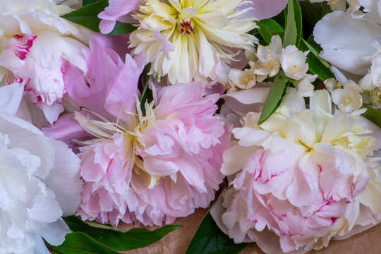 bouquet of flowers from peonies, roses, jasmine and wild herbs