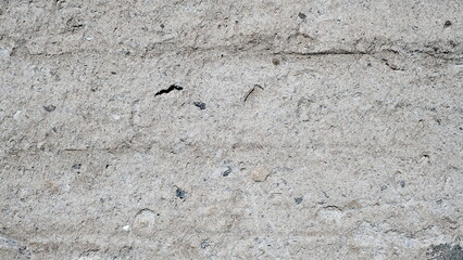 
The surface of an old concrete fence