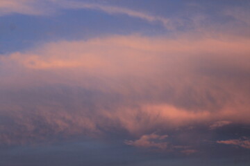 Fototapeta premium Clouds lit by the setting sun. Russia.