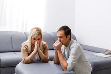 woman and man pray at home