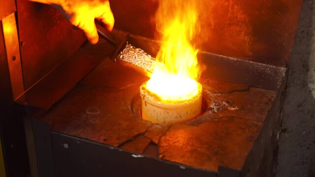 silver melting the hot stove in silver factory
hot jewel master in workshop. 