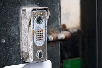 Fototapeta na wymiar Old door entry buzzer intercom broken require repair