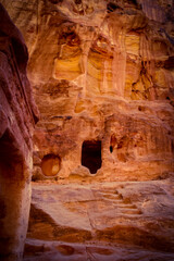Nabatean cave in the Wadi Musa leading to ancient Petra, Jordan, one of the New Seven Wonders of the World and one of Jordan's most popular UNESCO world heritage sites.