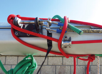 Accessories rigging boats. Capes of different colors on stainless steel structure under blue sky....