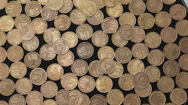 USSR coins on a black background. old money