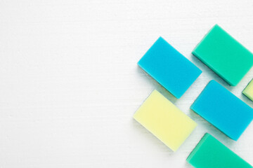 Cleaning services for cleaning the premises. Colored sponges on a white background