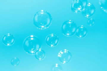 Blue soap bubbles background.