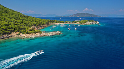 Fototapeta premium Aerial drone photo of secluded paradise bay and small island of Moni with turquoise crystal clear beach next to Aigina, Saronic gulf, Greece