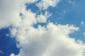 Blue sky with white clouds. Sunny summer day.