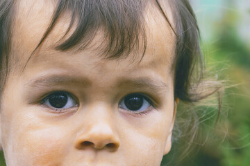 little boy with sad eyes
