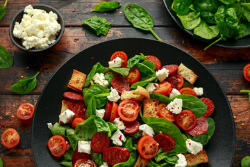 Chorizo Tomato salad with spinach, feta cheese and croutons. healthy summer food