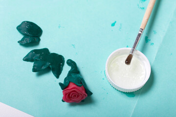 Roses with polymer clay petals. Glue and brush. Crafts from polymer clay.