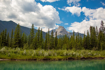 Blue sky with green lake and mountains