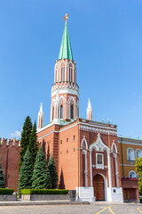 St. Nicholas Tower (or Nikolskaya Tower) of Moscow Kremlin with red ruby star on the top on a summer morning. Clear blue sky. Theme of travel in Russia.