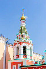 Fototapeta na wymiar View of Cathedral of Our Lady of Kazan (or Kazan Cathedral). It's a Russian Orthodox church located on the northeast corner of Red Square in Moscow. Blue sky.