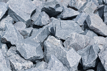 Crushed large gray stones of irregular shape.