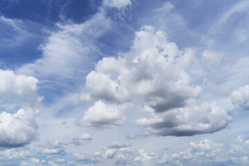 Naklejka na ściany i meble White clouds against blue sky, background