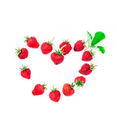 Heart made of fresh strawberries isolated on white background