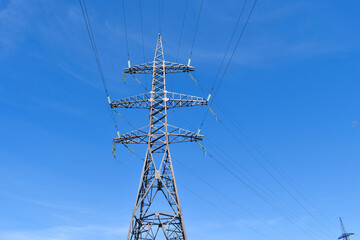 High-voltage power line against a clear blue sky, good weather