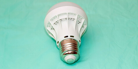 Led lamp close-up on a turquoise background.