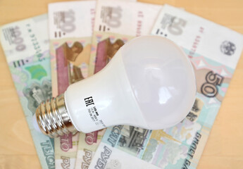 LED lamp lies on Russian money