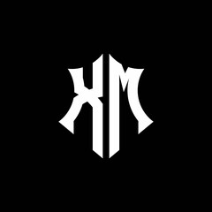 XM monogram logo with a sharp shield style