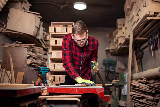 Cabinet Maker Working In His Garage