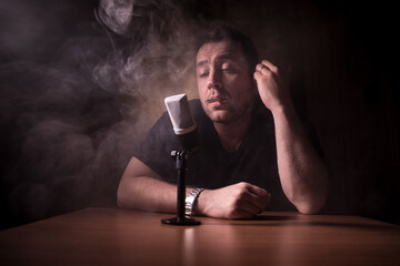 Serious reporter in television studio looking at the camera